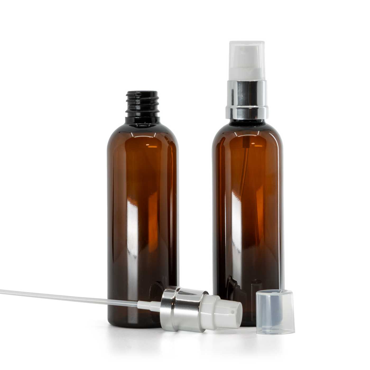 Flacon en plastique ambré avec pompe blanche et argentée brillante, 100 ml