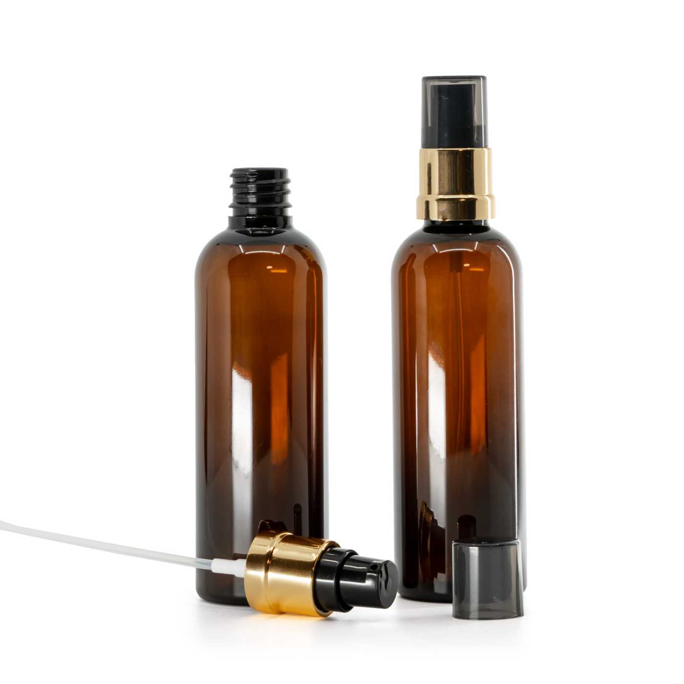 Flacon en plastique brun, pompe noire et dorée brillante avec surcapuchon fumé, 100 ml
