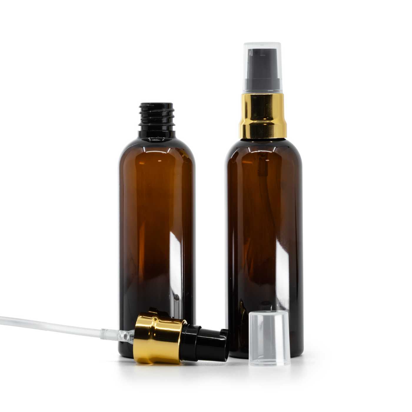 Flacon en plastique ambré, pompe noire et dorée brillante avec capot transparent, 100 ml