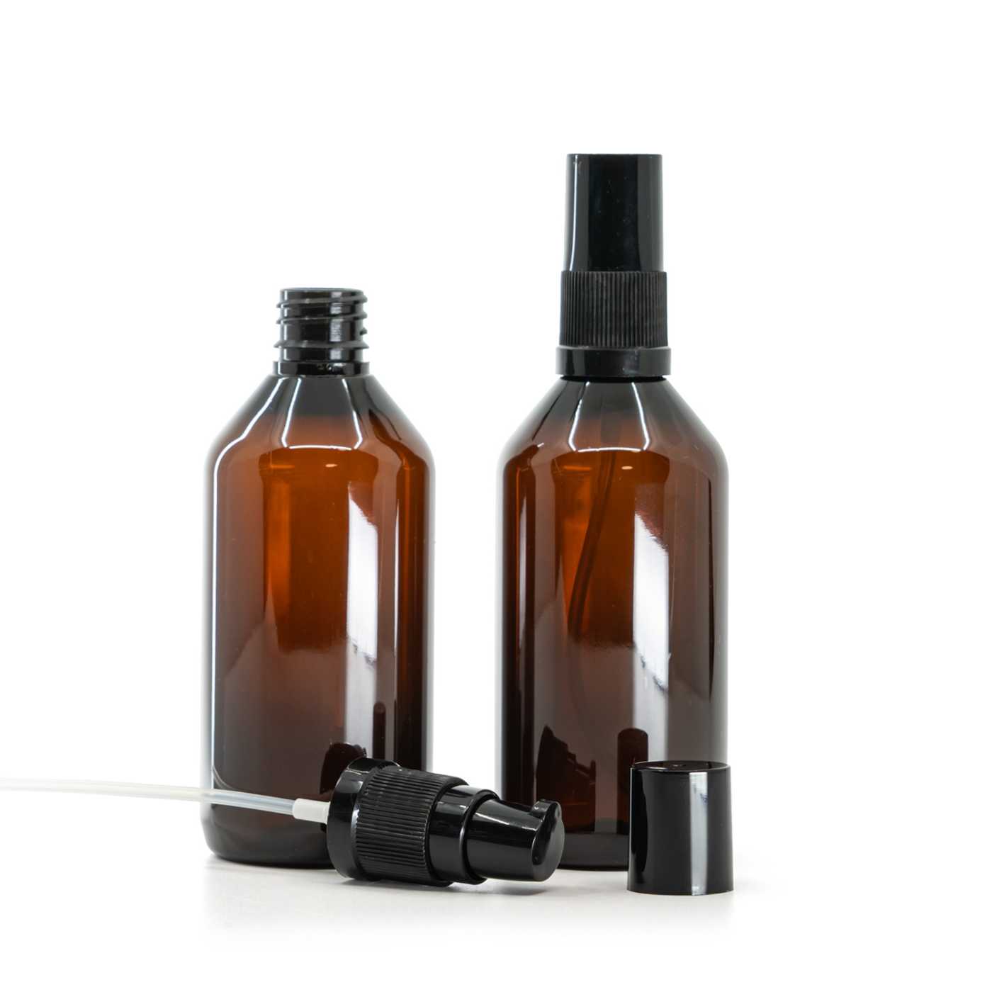 Flacon en plastique ambré avec pompe lotion noire et capuchon de protection noir, 115 ml