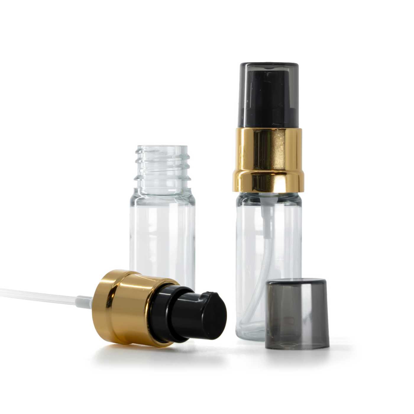 Műanyag üvegcse, átlátszó, fekete-arany fényes pumpa füstös felső kupakkal, 10 ml