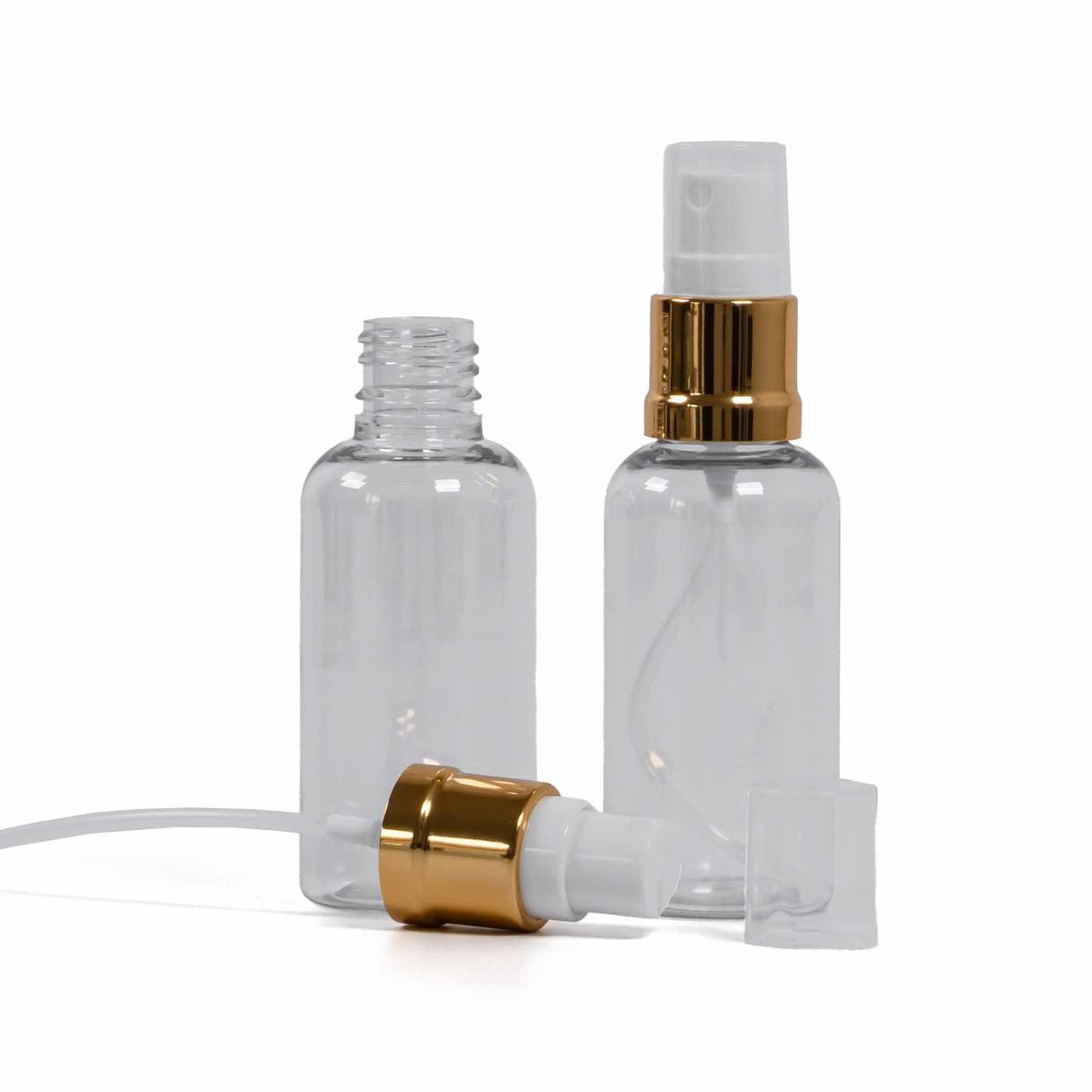 Átlátszó műanyag flakon fehér-arany permetezőfejjel 50 ml