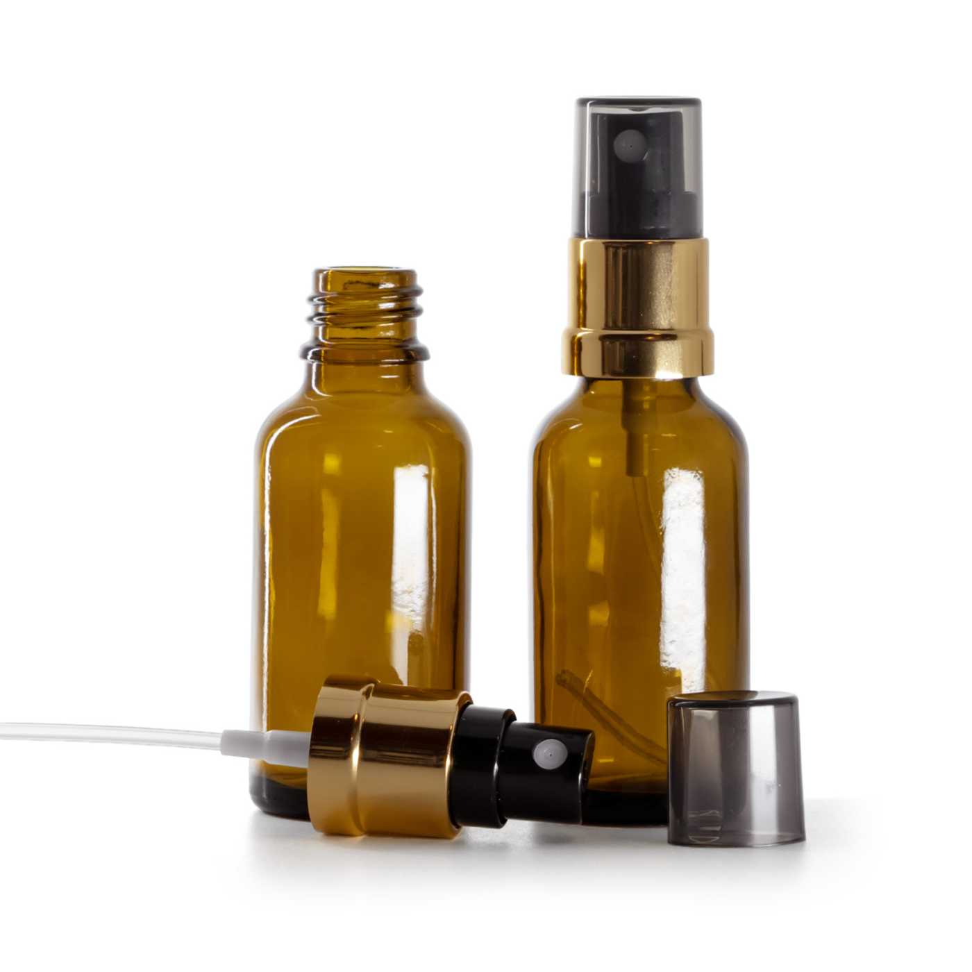 Flacon en verre brun, vaporisateur noir et or, surcapuchon fumé, 30 ml