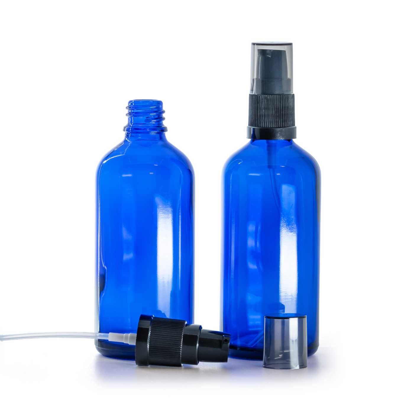 Flacon en verre bleu, pompe lotion avec surcapuchon fumé, 100 ml