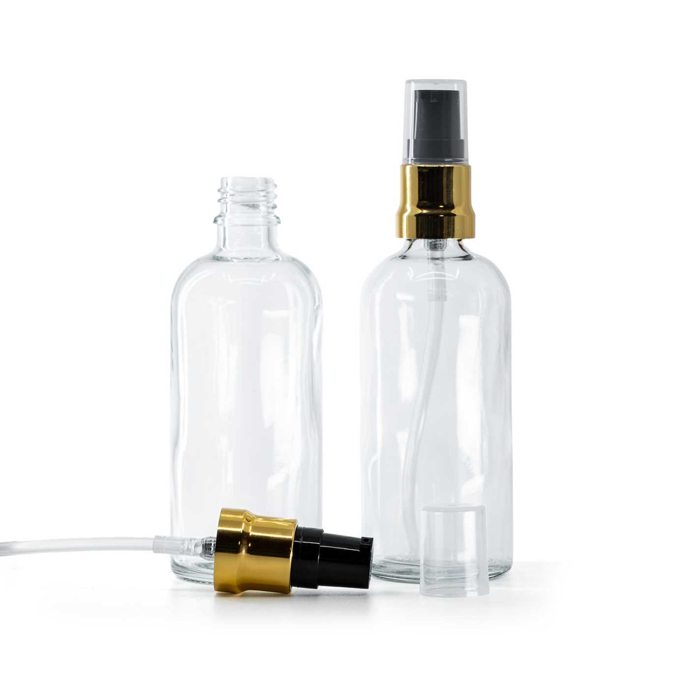 Butelka szklana, przezroczysta, czarno-złoty błyszczący dozownik, przezroczysty kapturek, 100 ml