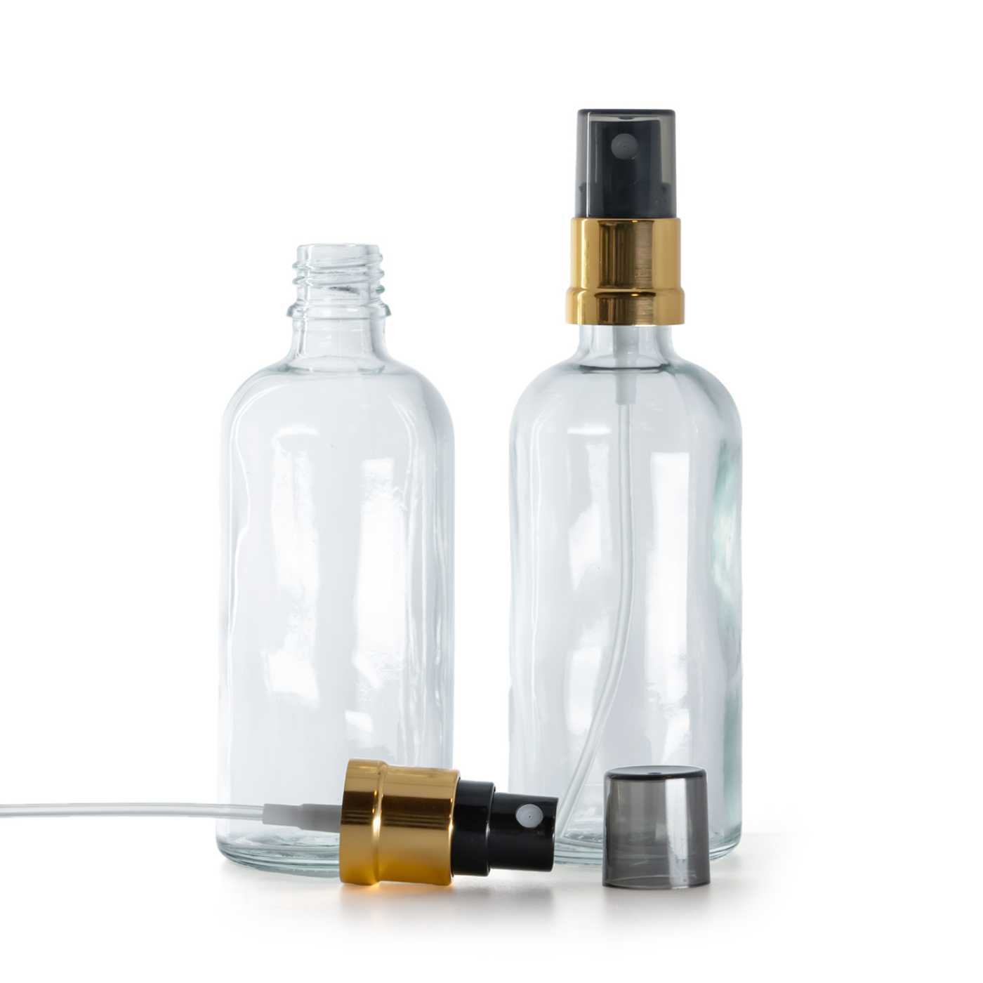 Butelka szklana, przezroczysta, czarno-złoty atomizer, przydymiony kapturek, 100 ml