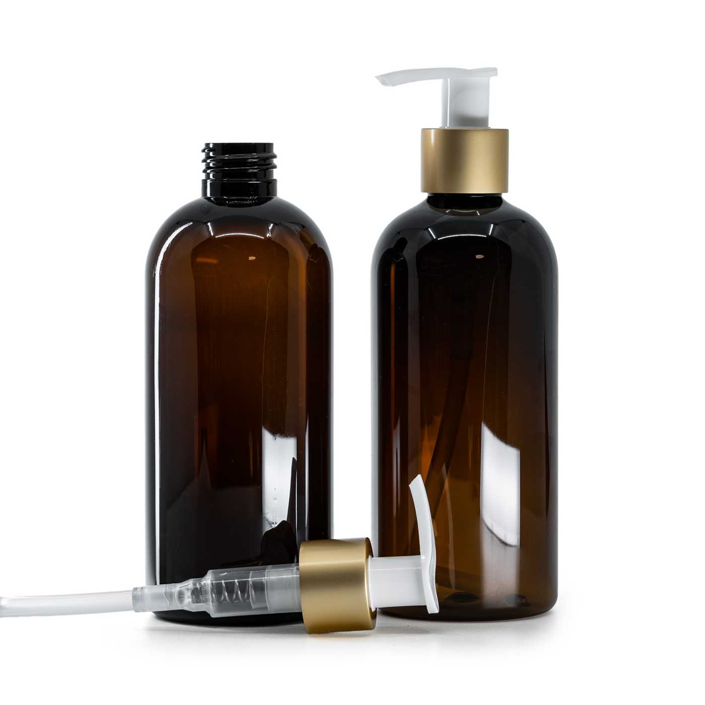 Flacon en plastique brun, pompe doseuse blanche avec col doré mat, 300 ml