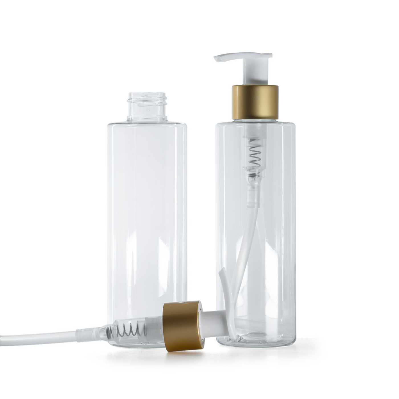 Flacon en plastique transparent, pompe blanche avec bague or mat, 200 ml